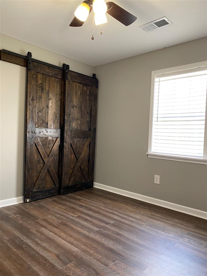1141 St Paul Road Mason, TN 38049 - Photo 9 of 12 Each bedroom has barn (closet) doors.