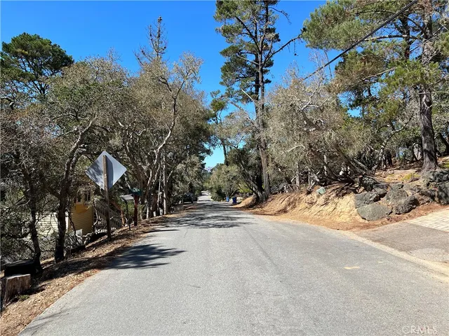 a view of street with parked cars