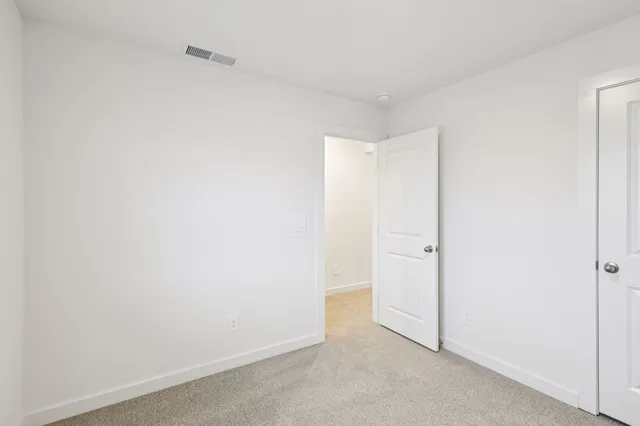 a big house with a big yard and large trees