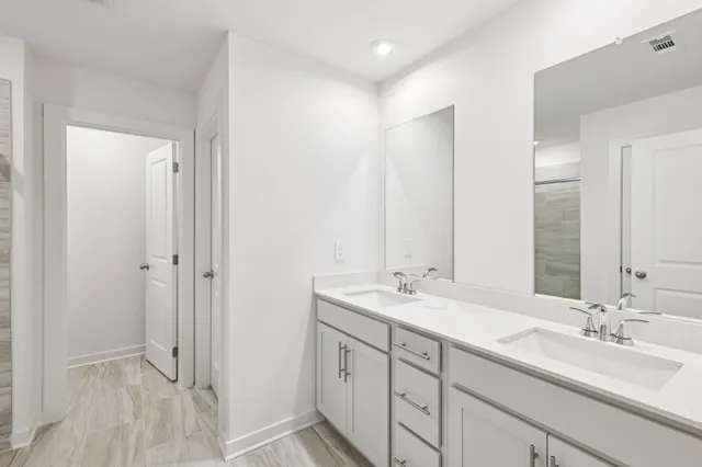 a view of house with backyard