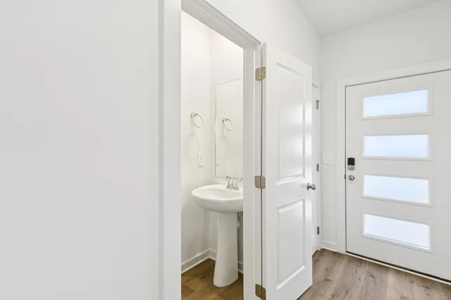 a bathroom with a granite countertop sink