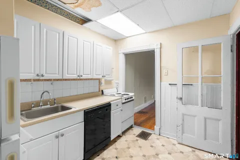 a kitchen with a sink and cabinets