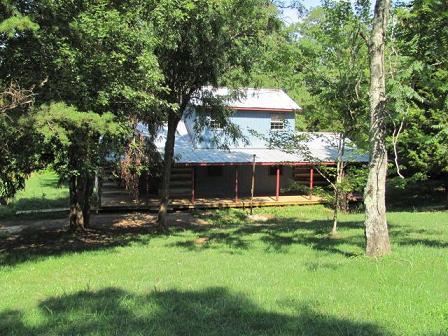 2084 Morgans Fork Road Penhook, VA 24137 - Photo 1 of 4 a front view of house with a garden