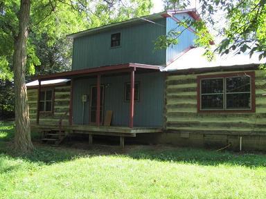 2084 Morgans Fork Road Penhook, VA 24137 - Photo 2 of 4 a front view of a house with a yard