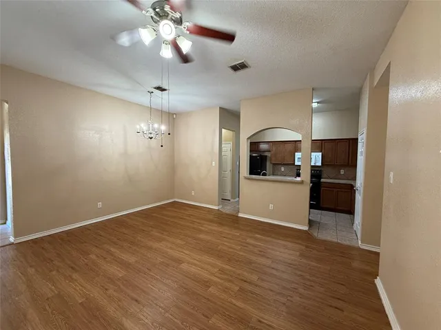 a view of a kitchen with a sink and a kitchen counter top space