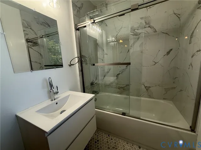 a bathroom with a sink and a bathtub