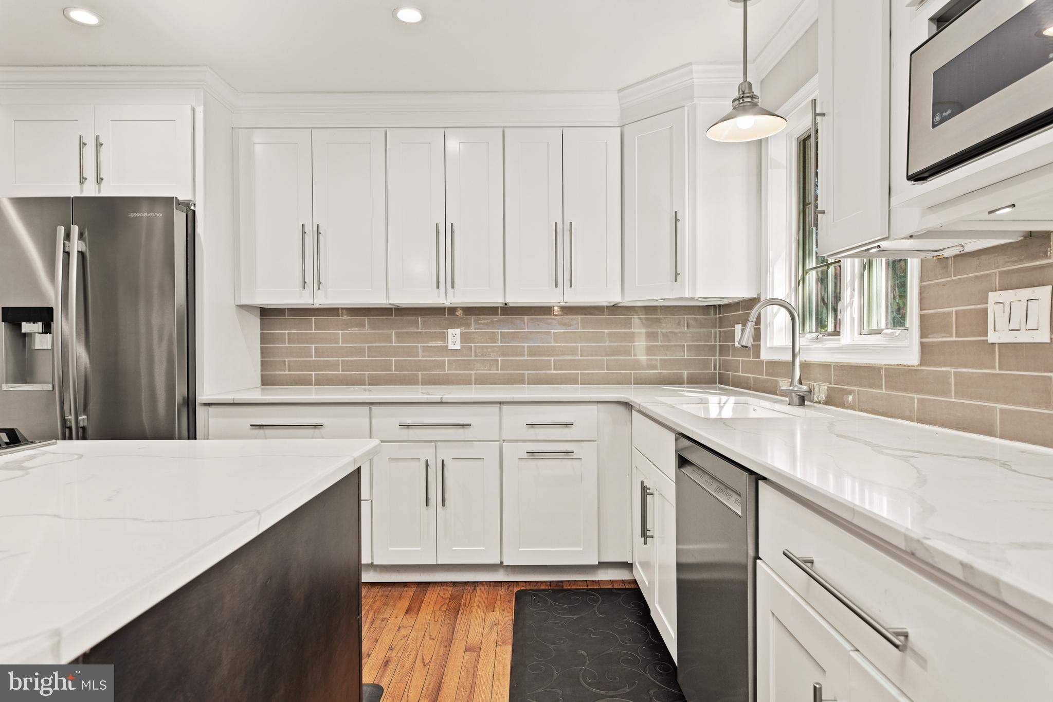 1429 Flat Rock Road Penn Valley, PA 19072 - Photo 18 of 58 a kitchen with stainless steel appliances granite countertop a sink stove and refrigerator