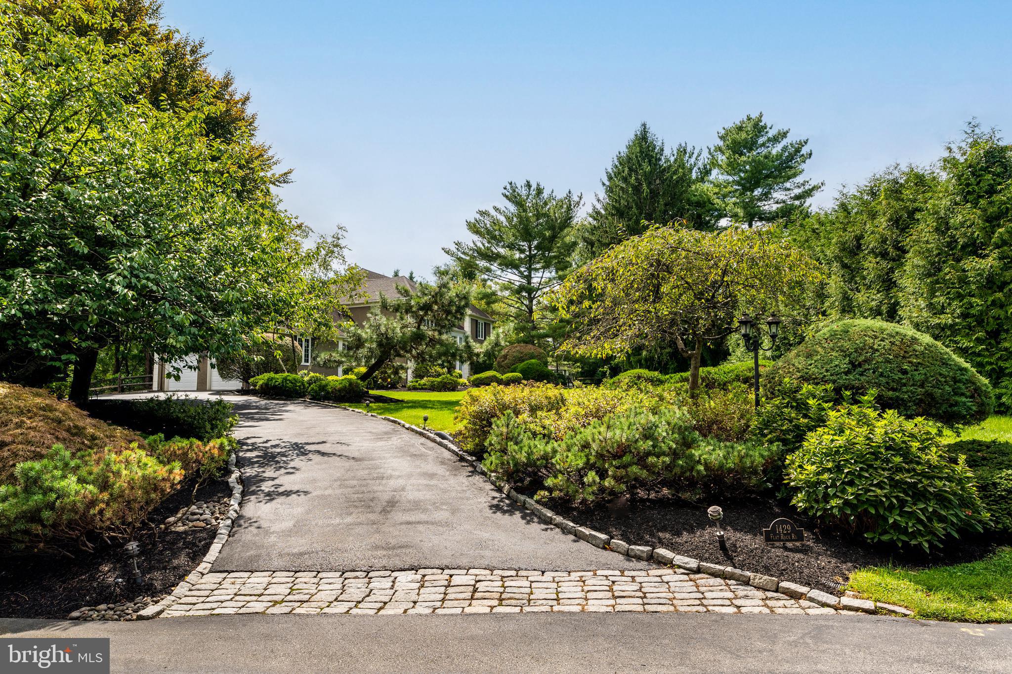 1429 Flat Rock Road Penn Valley, PA 19072 - Photo 5 of 58 a view of a garden with a pathway