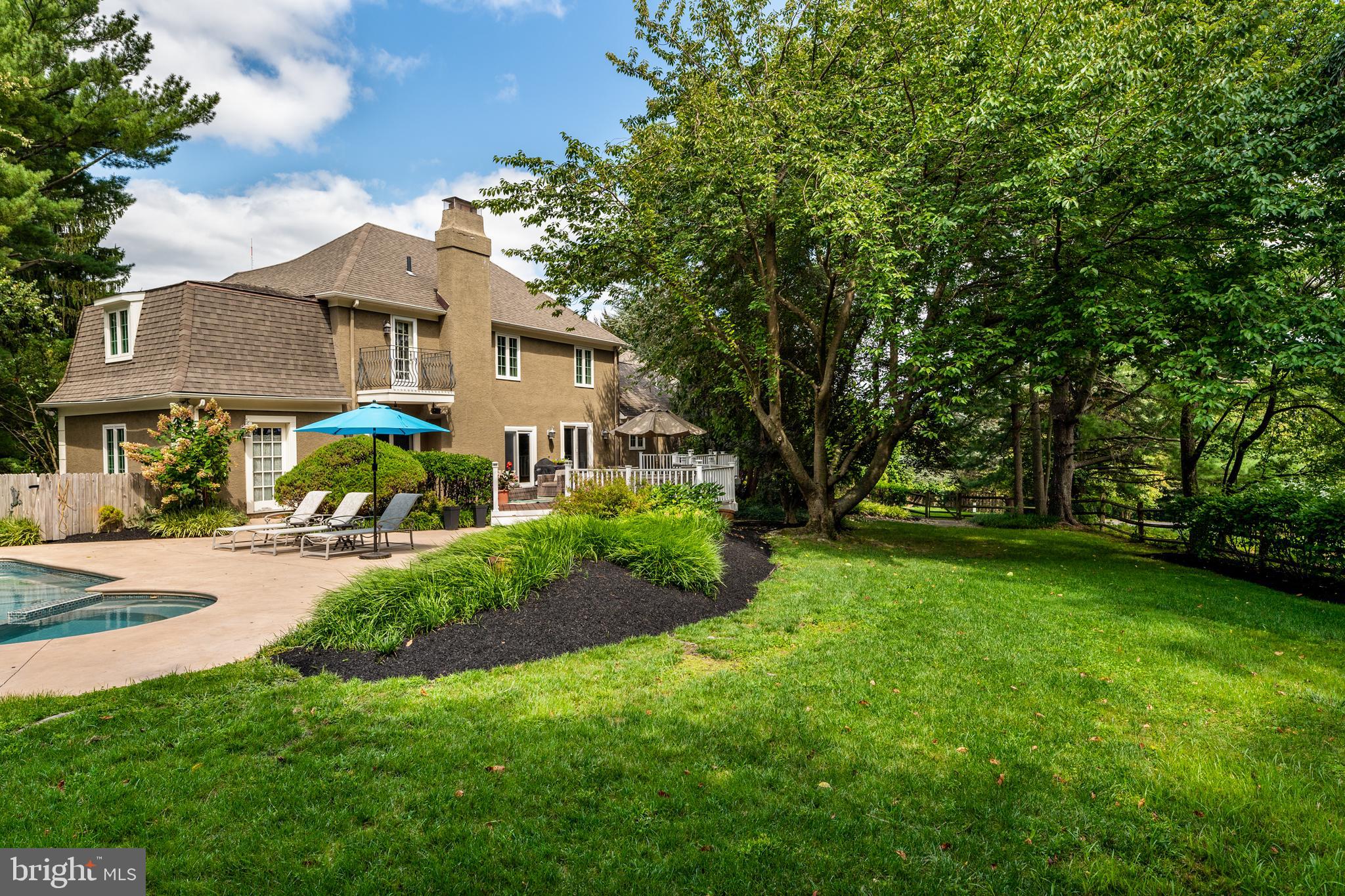 1429 Flat Rock Road Penn Valley, PA 19072 - Photo 53 of 58 a view of a house with a big yard plants and large trees