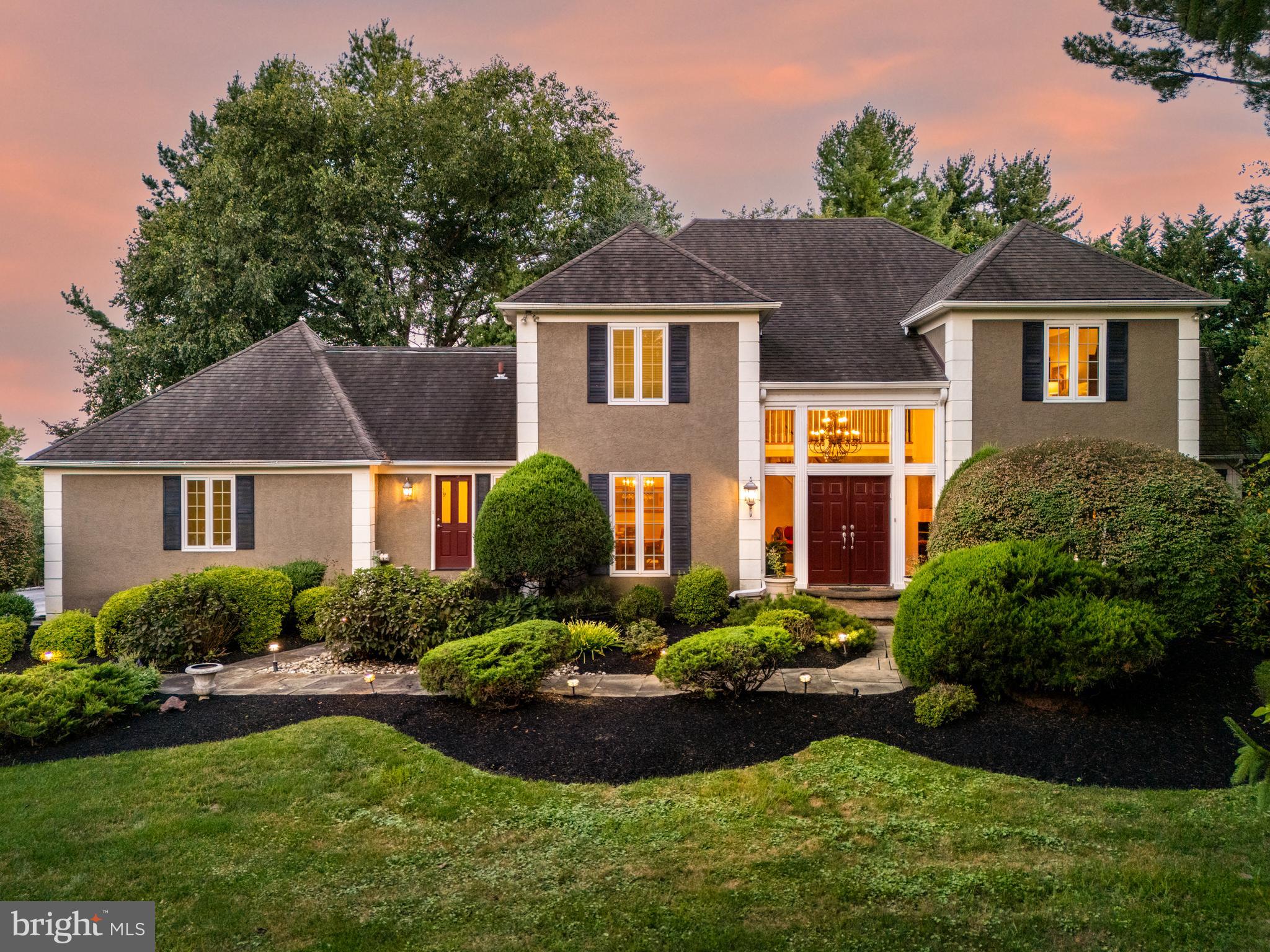 1429 Flat Rock Road Penn Valley, PA 19072 - Photo 57 of 58 a front view of a house with a yard and potted plants