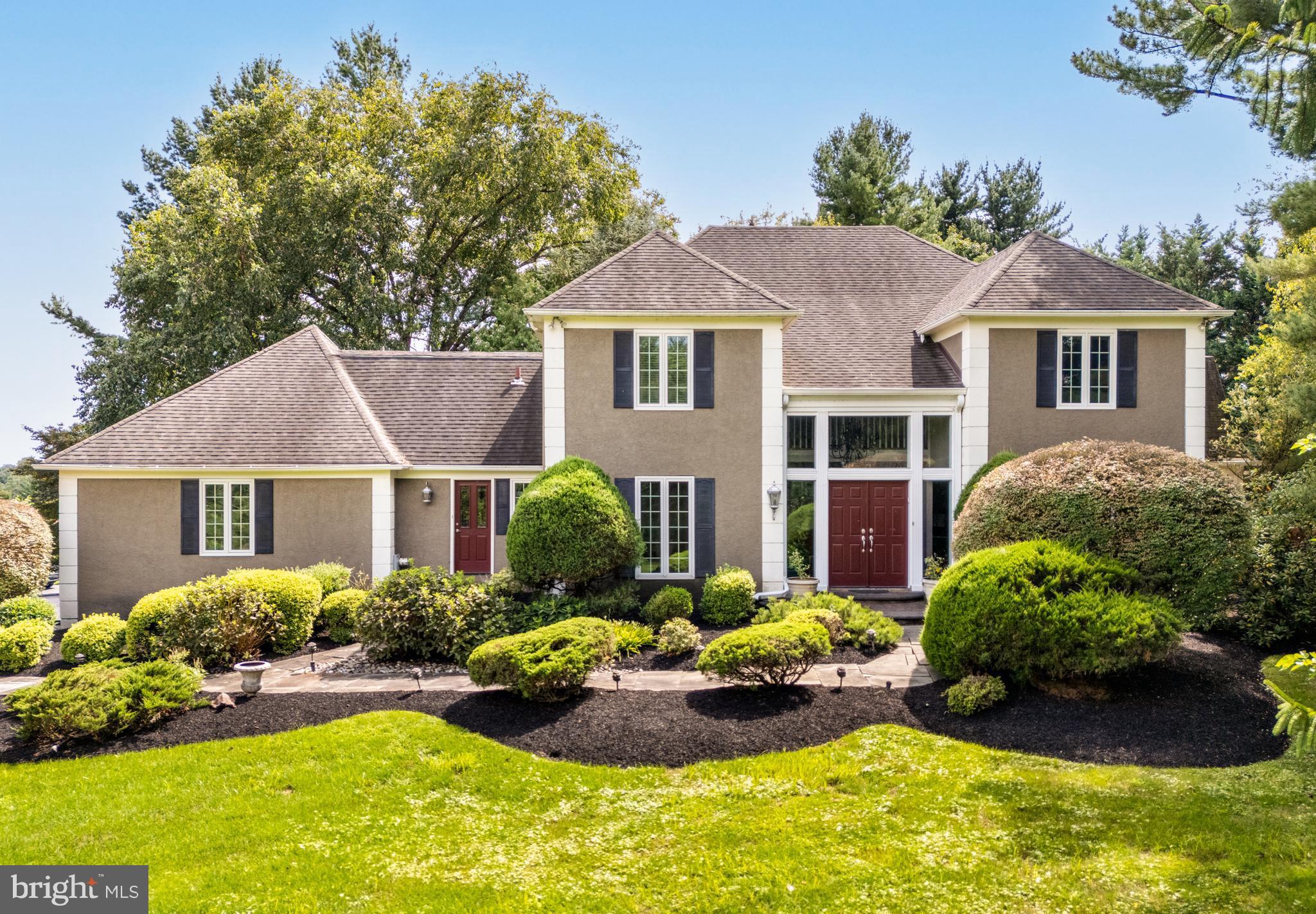 1429 Flat Rock Road Penn Valley, PA 19072 - Photo 7 of 58 a front view of a house with a yard and porch