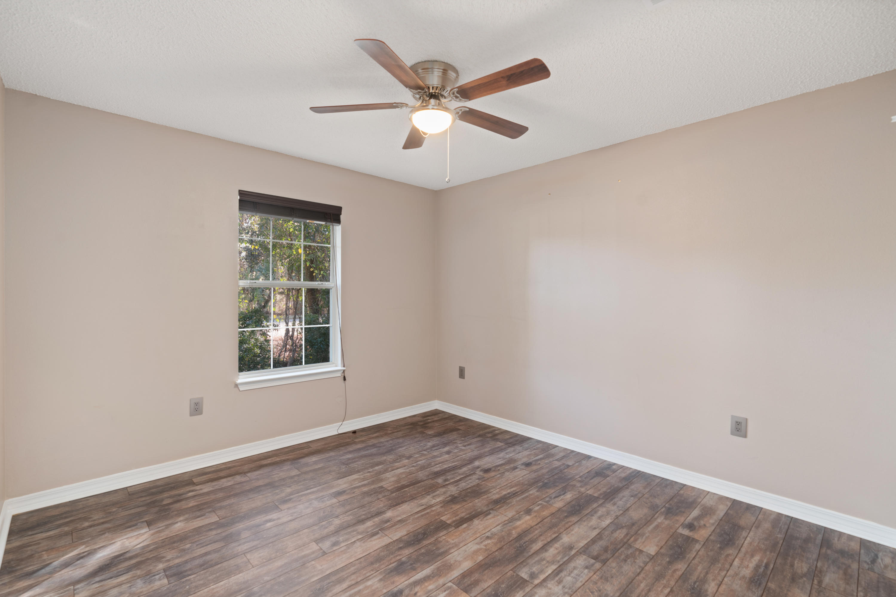 15 Bayou Landing Road Miramar Beach, FL 32550 - Photo 8 of 29 an empty room with wooden floor and windows