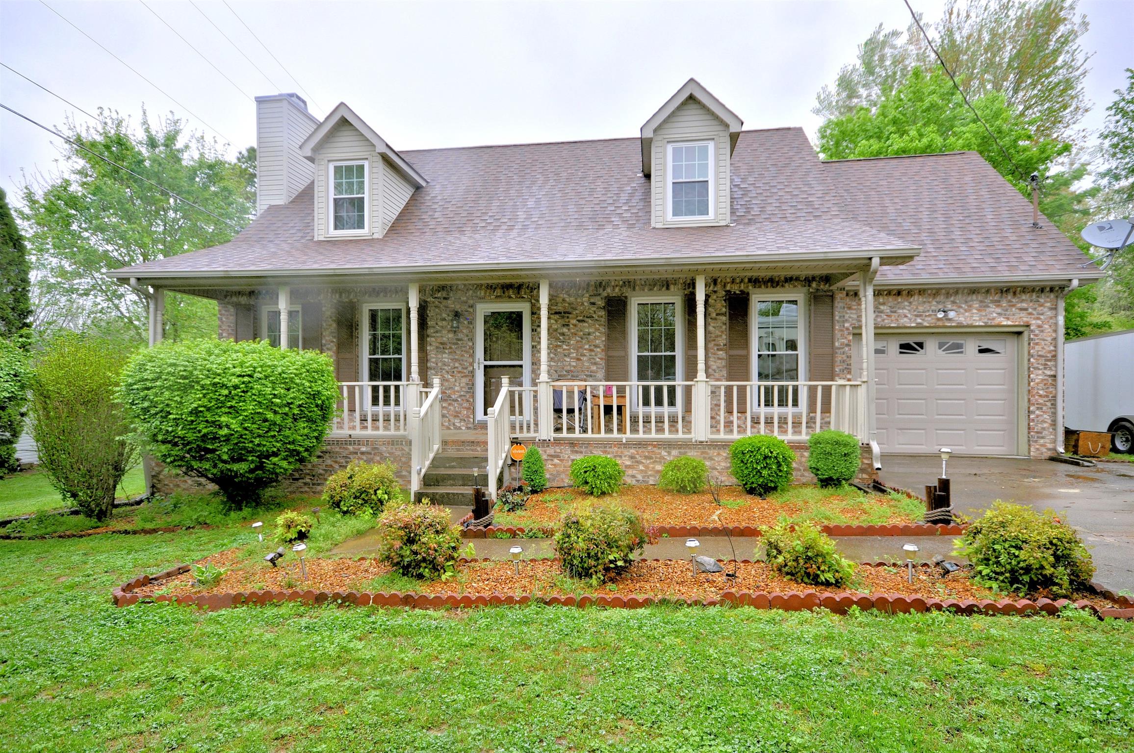 807 Hadley Road Clarksville, TN 37042 - Photo 1 of 1 a front view of a house with a yard and potted plants