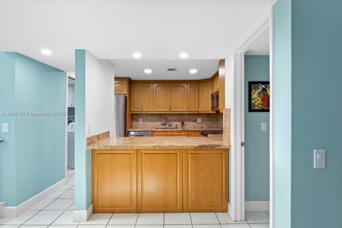 9450 Live Oak Place, Unit 109 Davie, FL 33324 - Photo 13 of 98 a view of a kitchen with a sink