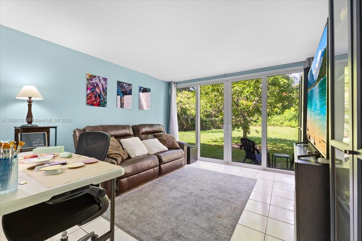 9450 Live Oak Place, Unit 109 Davie, FL 33324 - Photo 20 of 98 a living room with furniture and a large window