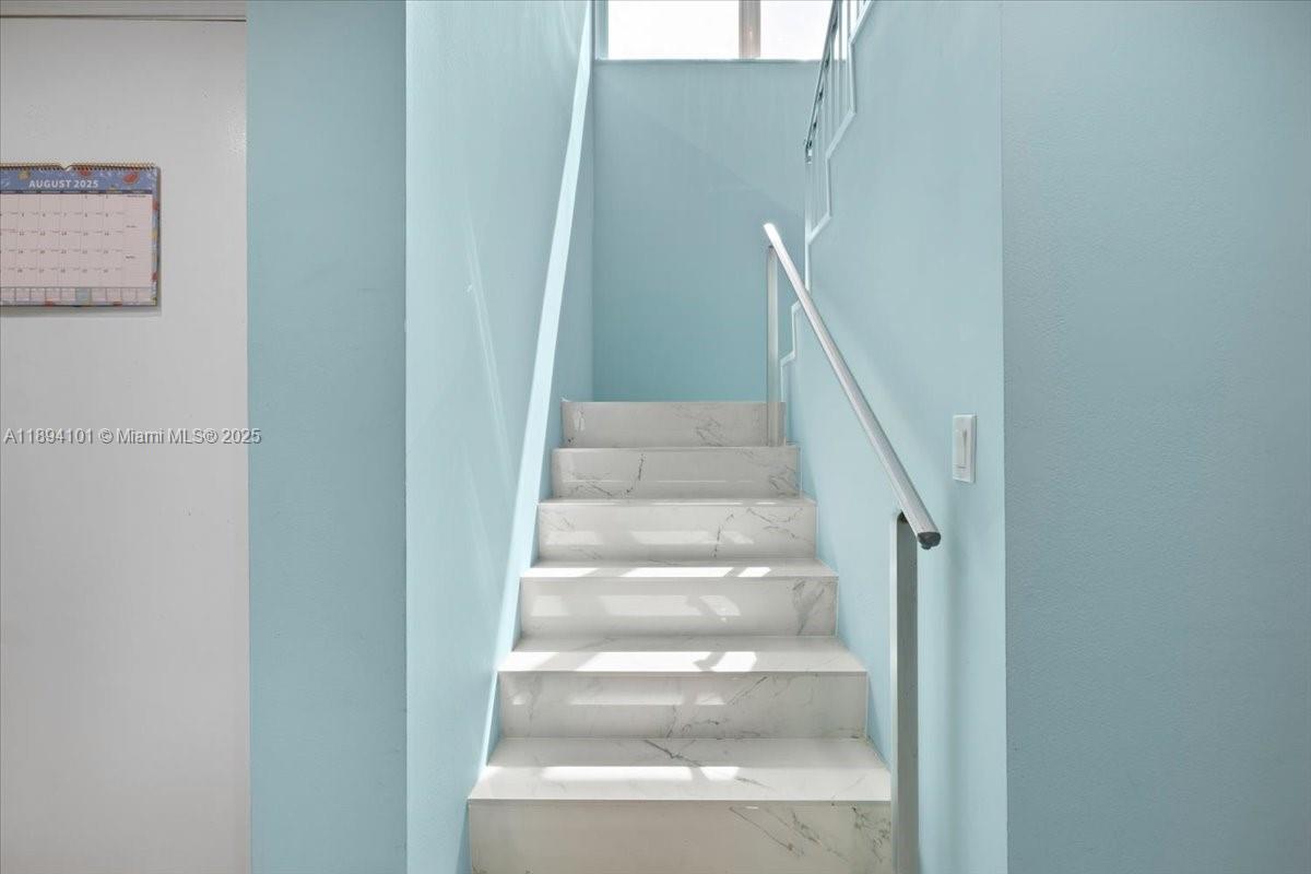 9450 Live Oak Place, Unit 109 Davie, FL 33324 - Photo 27 of 98 a view of staircase with white walls