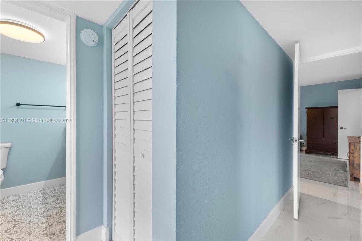 9450 Live Oak Place, Unit 109 Davie, FL 33324 - Photo 35 of 98 a view of a hallway with closet and bathroom