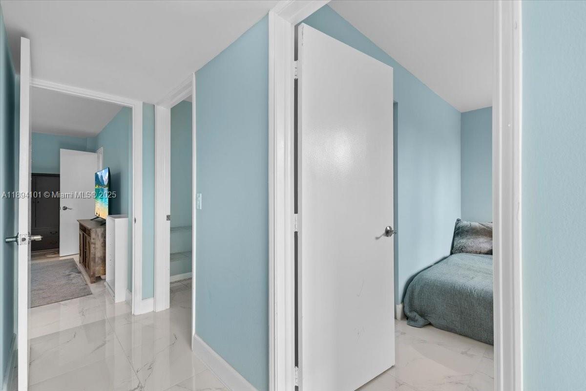 9450 Live Oak Place, Unit 109 Davie, FL 33324 - Photo 37 of 98 a en suite bathroom with a sink and a mirror