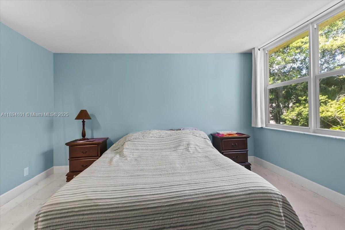 9450 Live Oak Place, Unit 109 Davie, FL 33324 - Photo 40 of 98 a bedroom with a bed and window