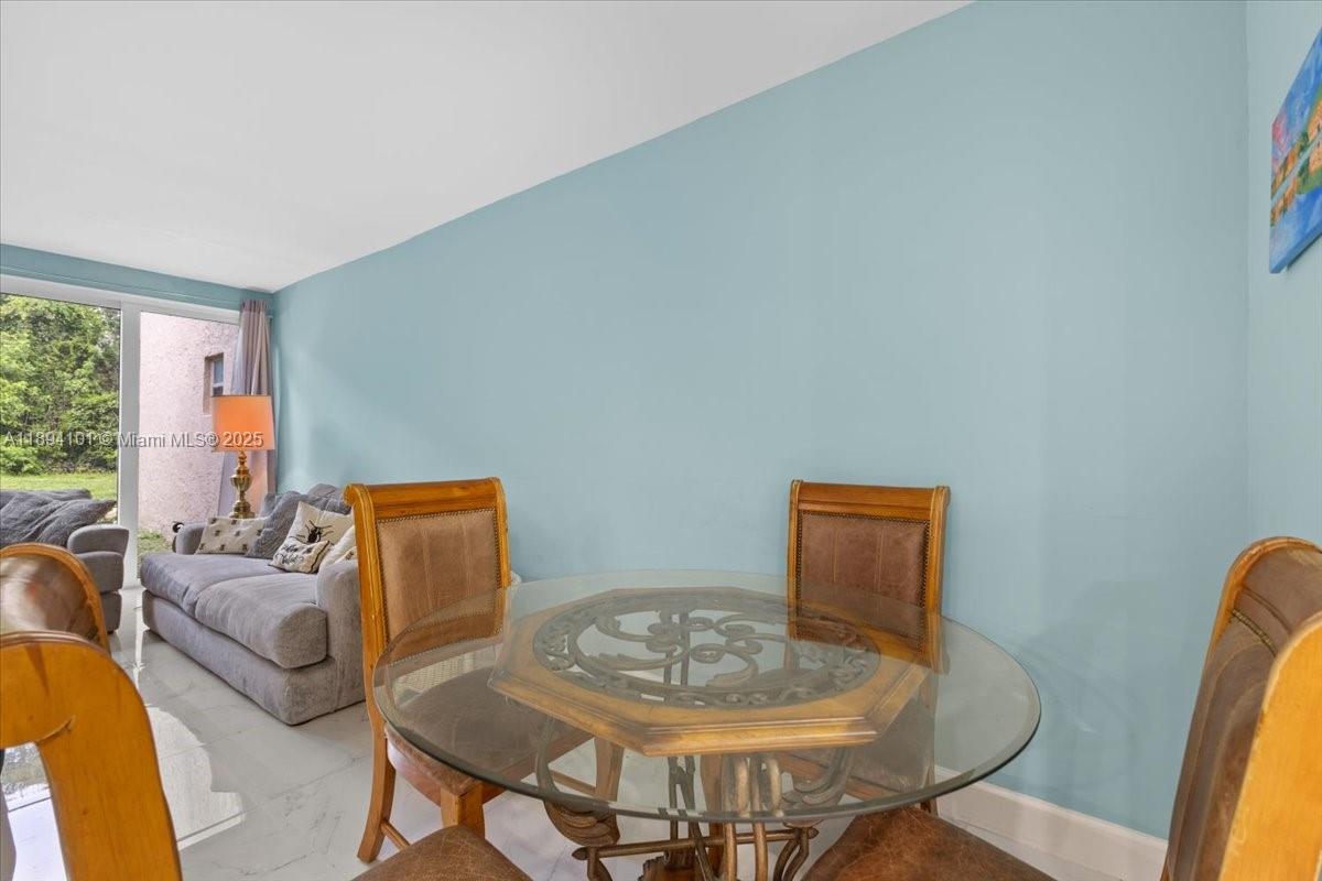 9450 Live Oak Place, Unit 109 Davie, FL 33324 - Photo 4 of 98 a living room with furniture and a wooden floor