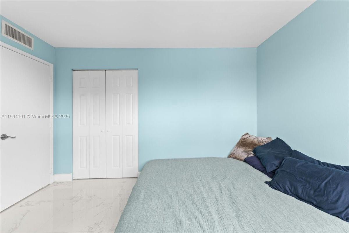 9450 Live Oak Place, Unit 109 Davie, FL 33324 - Photo 56 of 98 a bedroom with a bed and a window