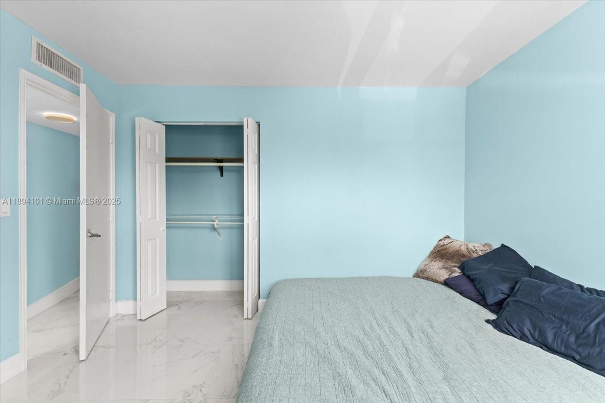 9450 Live Oak Place, Unit 109 Davie, FL 33324 - Photo 57 of 98 a bedroom with a bed and a large window