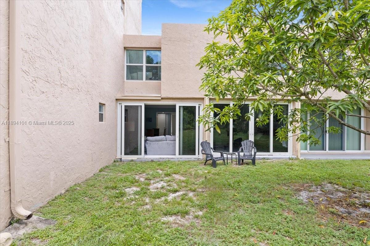 9450 Live Oak Place, Unit 109 Davie, FL 33324 - Photo 58 of 98 front view of a house with a yard