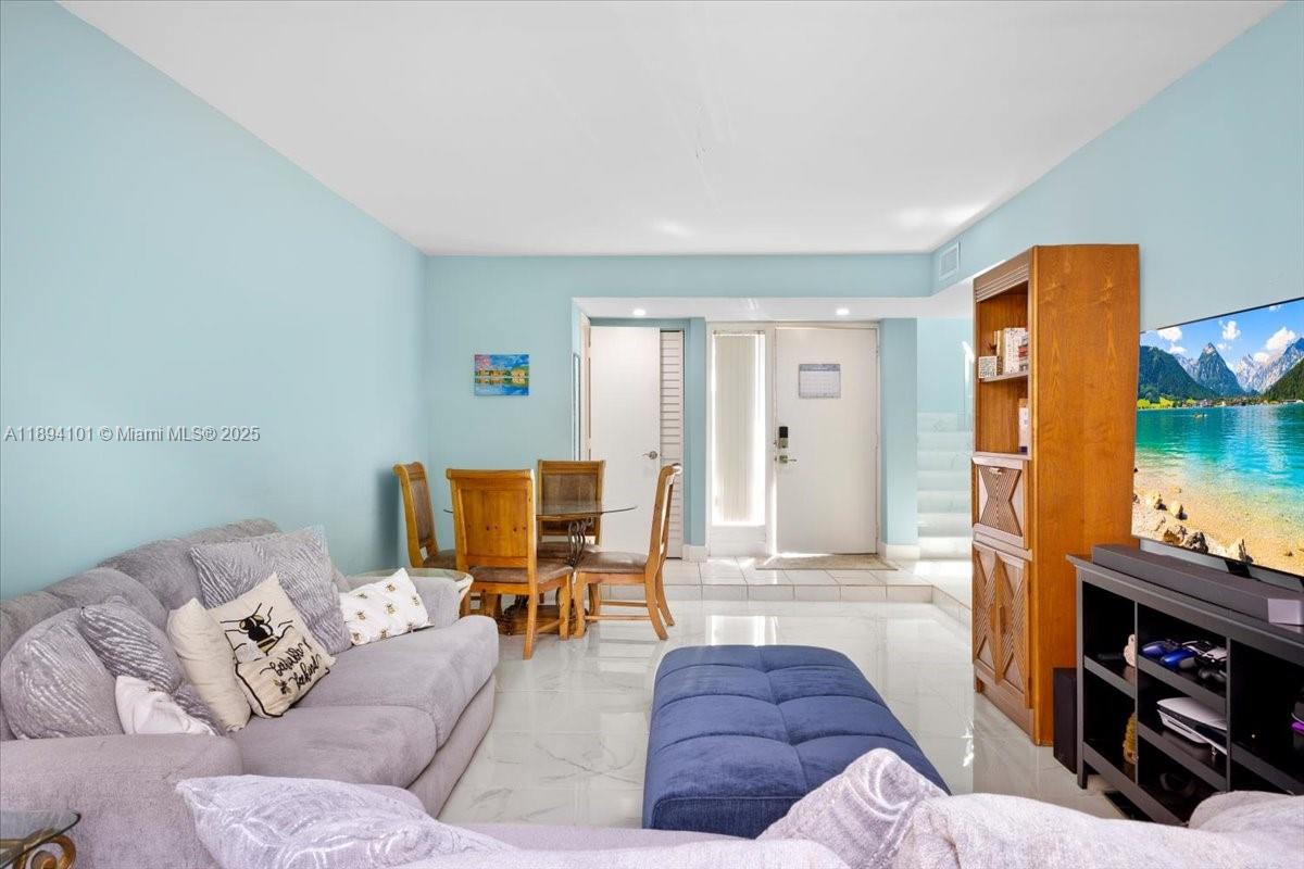 9450 Live Oak Place, Unit 109 Davie, FL 33324 - Photo 6 of 98 a living room with furniture and a flat screen tv