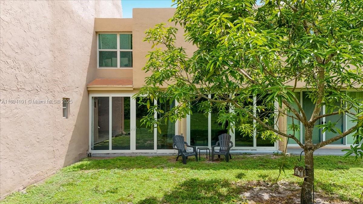 9450 Live Oak Place, Unit 109 Davie, FL 33324 - Photo 82 of 98 front view of a house with a yard