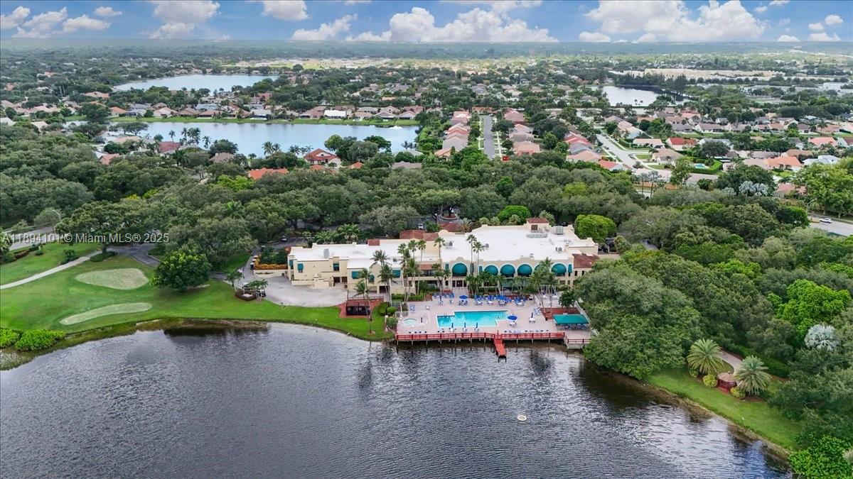 9450 Live Oak Place, Unit 109 Davie, FL 33324 - Photo 83 of 98 an aerial view of a house with a yard and lake view
