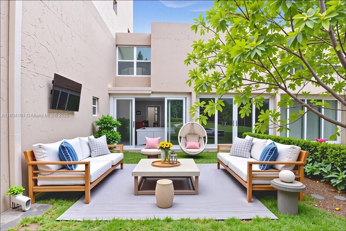 9450 Live Oak Place, Unit 109 Davie, FL 33324 - Photo 95 of 98 a outdoor living space with furniture and a fireplace