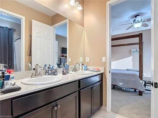 a bathroom with a sink double vanity and a mirror