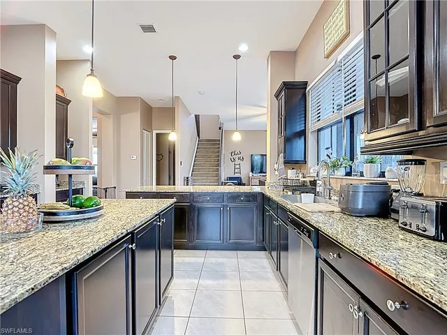 a kitchen with granite countertop lots of counter top space