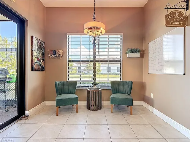 a dining room with furniture and window