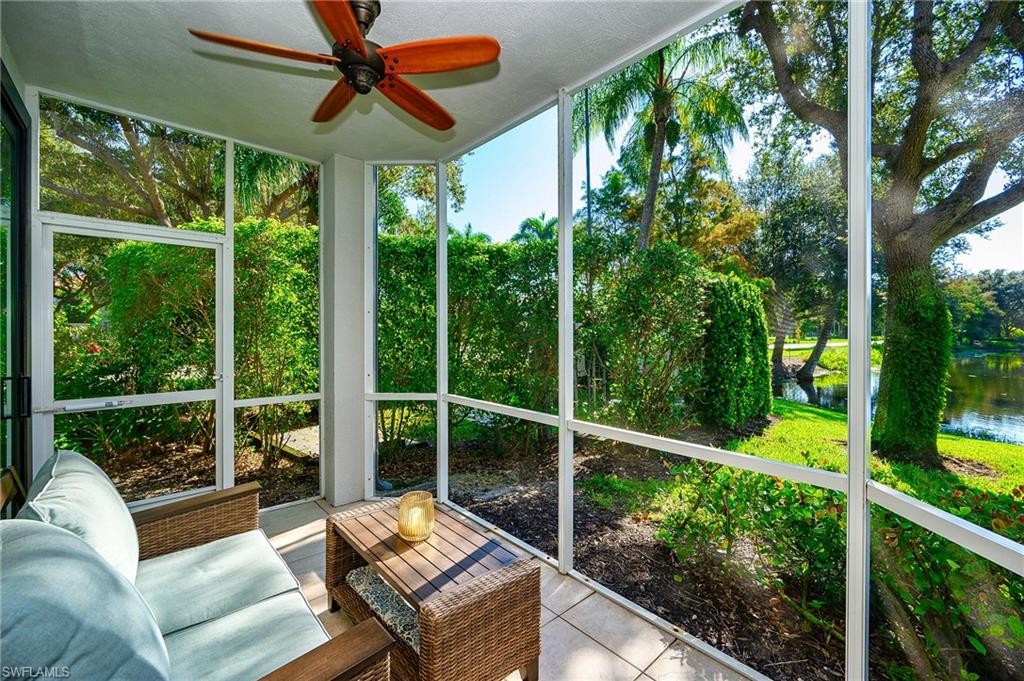 2371 Ravenna Boulevard, Unit 101 Naples, FL 34109 - Photo 21 of 44 Sunroom / solarium featuring ceiling fan, plenty of natural light, and a water view