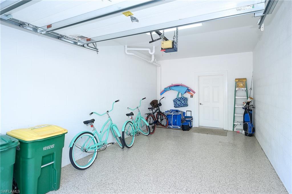 2371 Ravenna Boulevard, Unit 101 Naples, FL 34109 - Photo 24 of 44 Garage with a garage door opener