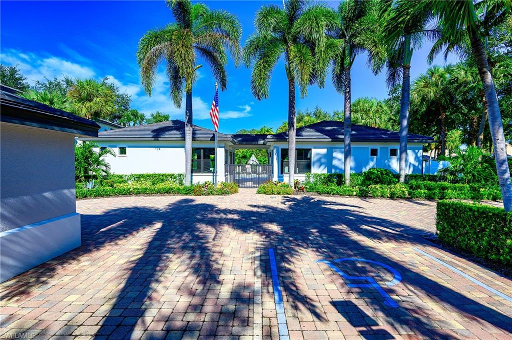 2371 Ravenna Boulevard, Unit 101 Naples, FL 34109 - Photo 26 of 44 View of rear view of house