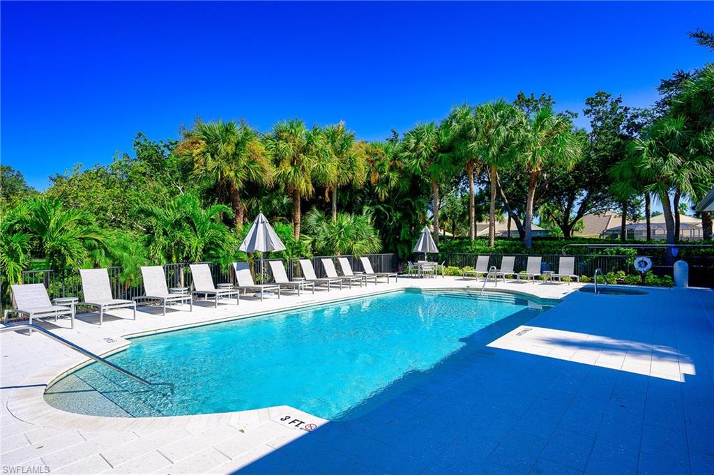 2371 Ravenna Boulevard, Unit 101 Naples, FL 34109 - Photo 30 of 44 View of swimming pool with a patio area