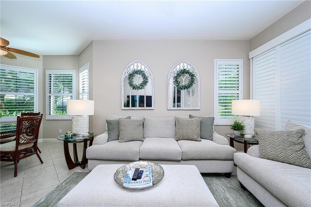 2371 Ravenna Boulevard, Unit 101 Naples, FL 34109 - Photo 3 of 44 Living room featuring light tile patterned floors and ceiling fan
