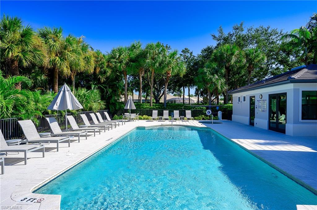2371 Ravenna Boulevard, Unit 101 Naples, FL 34109 - Photo 31 of 44 View of swimming pool with a patio
