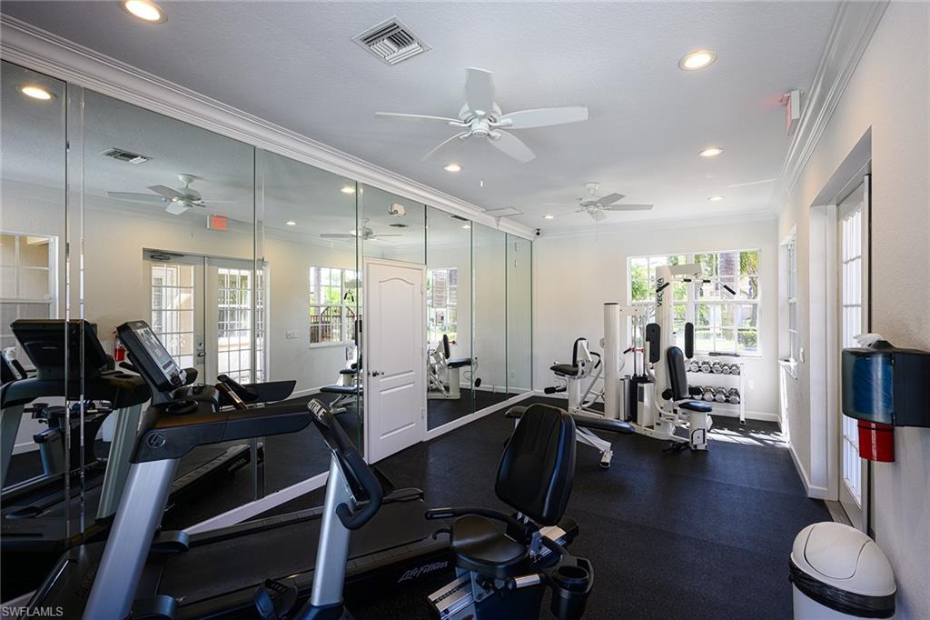 2371 Ravenna Boulevard, Unit 101 Naples, FL 34109 - Photo 36 of 44 Gym featuring crown molding and ceiling fan