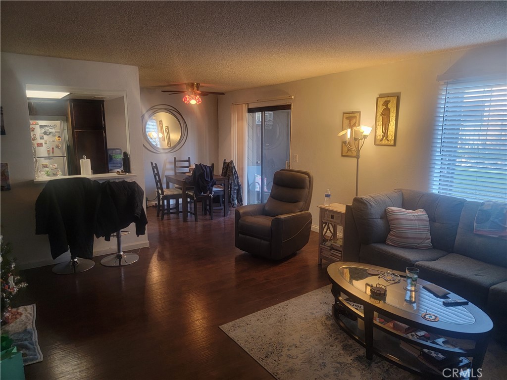 1304 Mountain Avenue, Unit 118 Duarte, CA 91010 - Photo 3 of 9 a living room with furniture and wooden floor