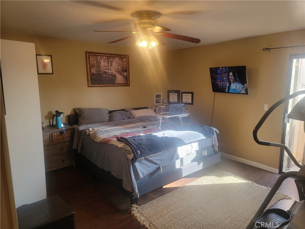 1304 Mountain Avenue, Unit 118 Duarte, CA 91010 - Photo 6 of 9 a spacious bedroom with a bed and a chandelier