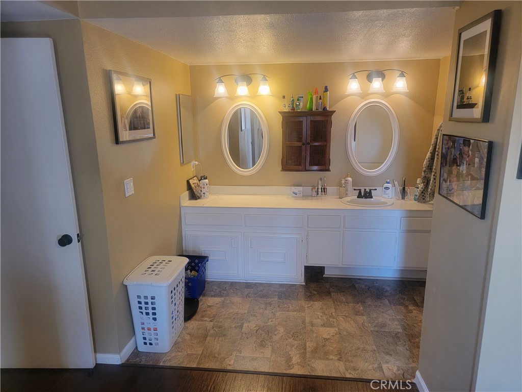 1304 Mountain Avenue, Unit 118 Duarte, CA 91010 - Photo 7 of 9 a bathroom with a mirror sink and mirror