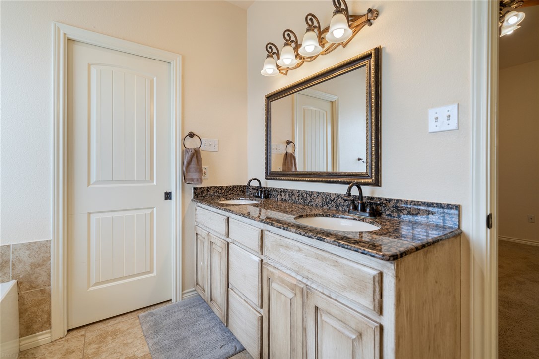 5889 Hidden Valley Loop Sandia, TX 78383 - Photo 22 of 36 Double vanities in primary bathroom