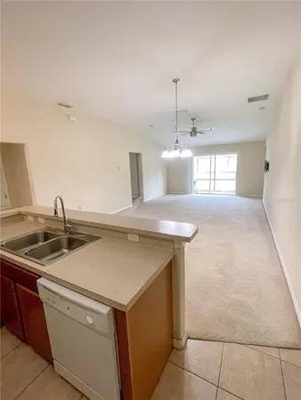 a bathroom with a sink a toilet a mirror and vanity