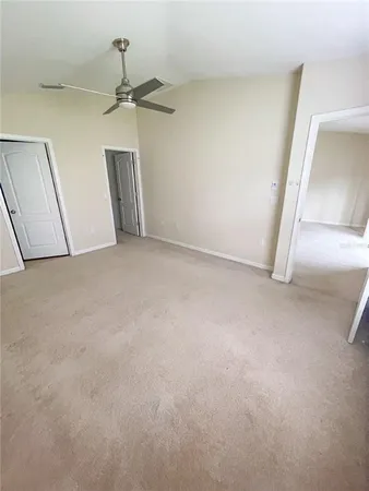 a view of a big room with mirror and stairs