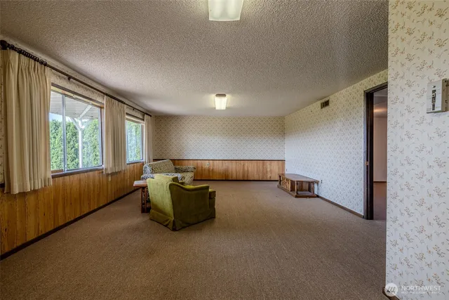 a room with furniture and a large window