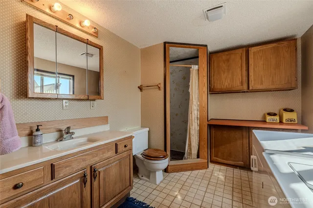 a kitchen with a sink stove and refrigerator