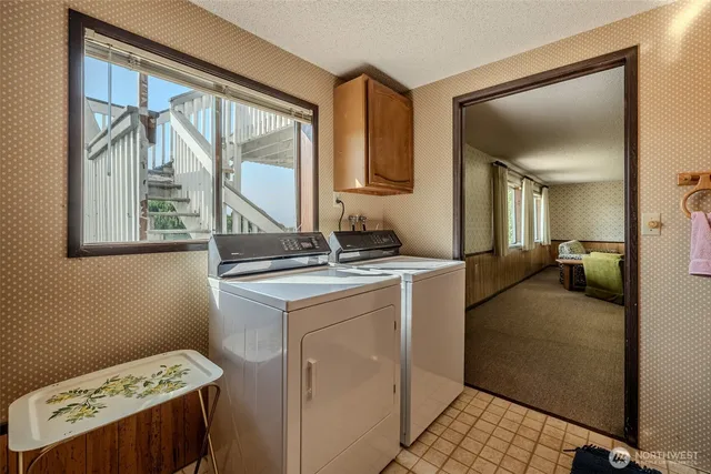 a en suite bathroom with a granite countertop sink and a mirror